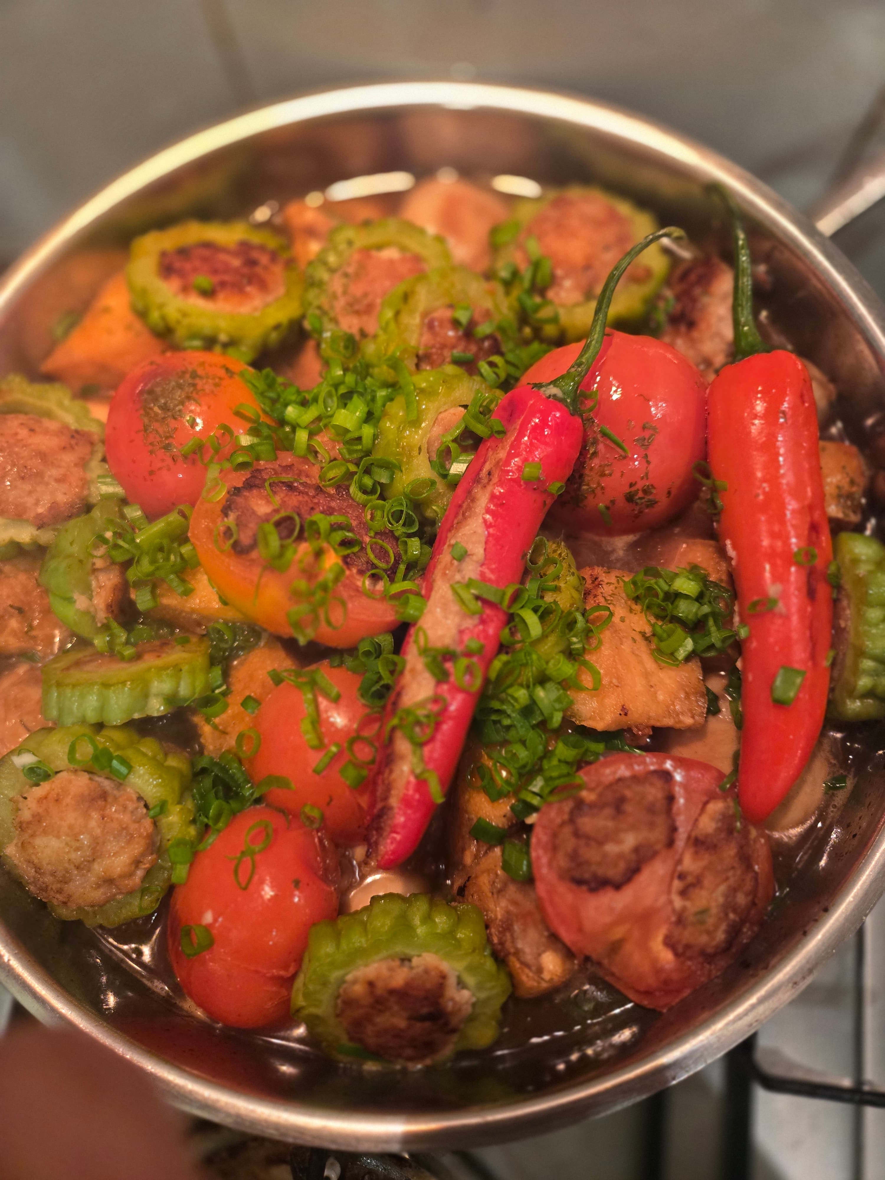 Stuffed yong tau foo pieces — chillies, bitter gourd rings, tomatoes — packed with pork-and-fish paste