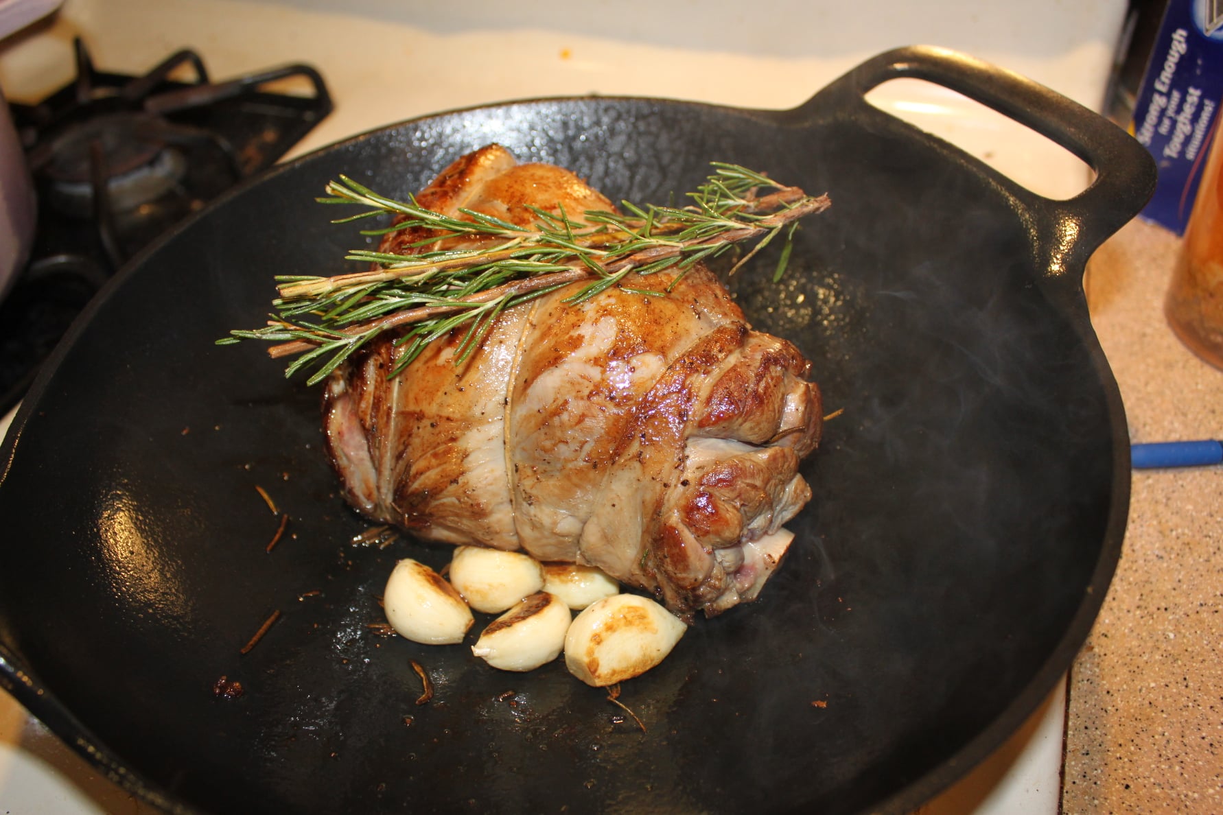 Rosemary Lamb Shank with Lingonberry Agrodolce on Pearl Couscous – Kevin Lee